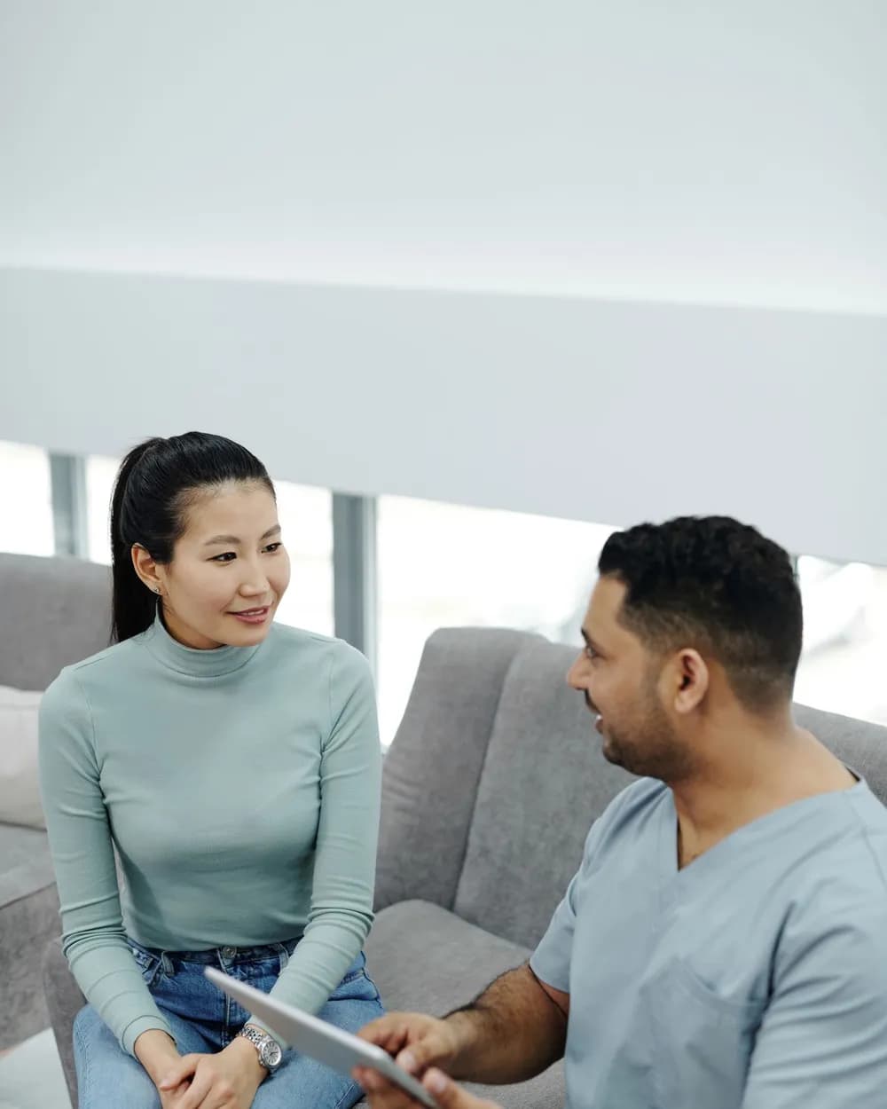 Dentist talking with a patient about her treatment plan